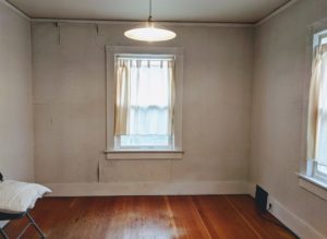 Empty room with peeling wallpaper