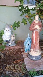 Garden gnome and St. Francis statue