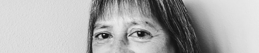 black and white image of eyes of a woman