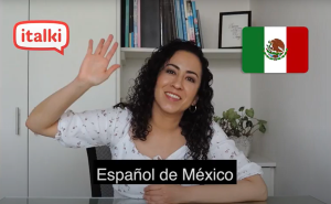 A young Mexican woman waving in an ad for online Spanish lessons