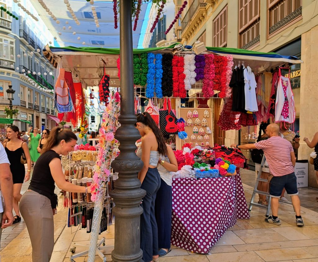 Booth selling flowers, fans, shawls, hats and other Flamenco items