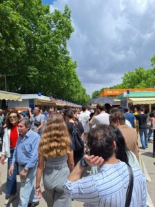 A crowd of people at an outdoor book fair.