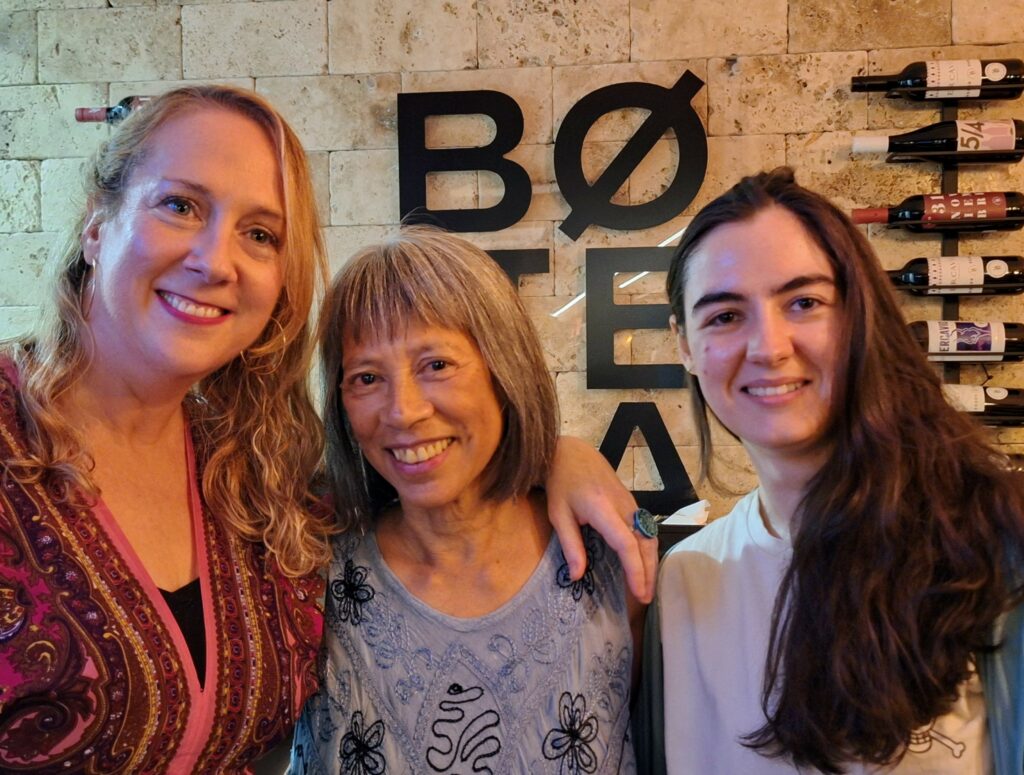 Three women smiling