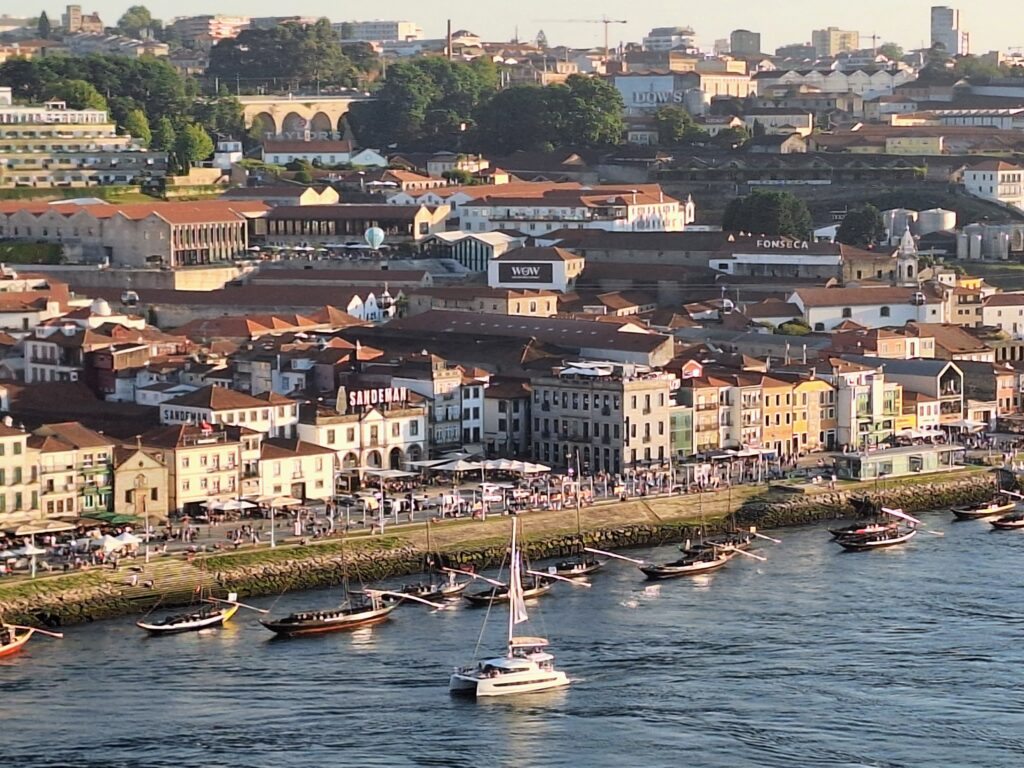 View of boats on the River Douro with buildings in the background in Porto. Portugal