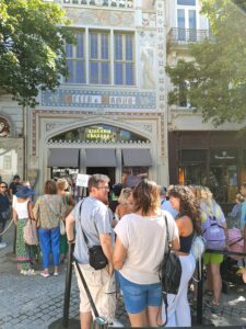 People lined up in front of Livaria Lello in Porto, Portugal.