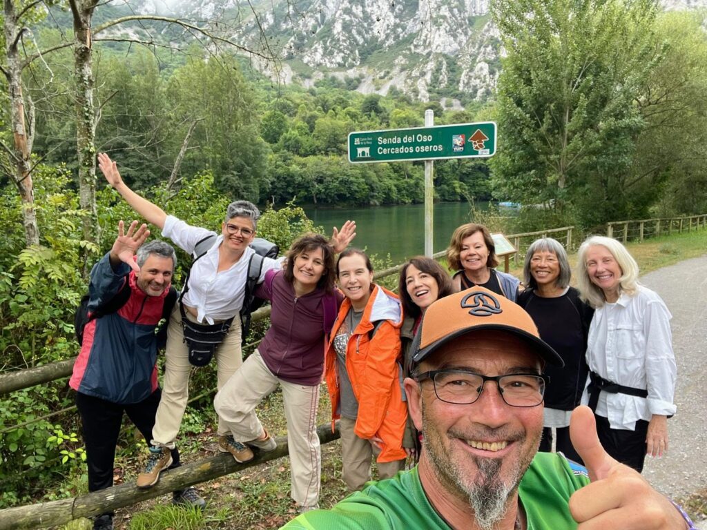 Hikers posing on a the Senda de Osos trail in Asturias, Spain